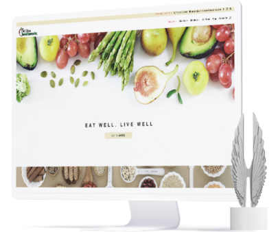 a monitor displaying the nutrition healthworks website alongside the platinum award this project won from Hermes