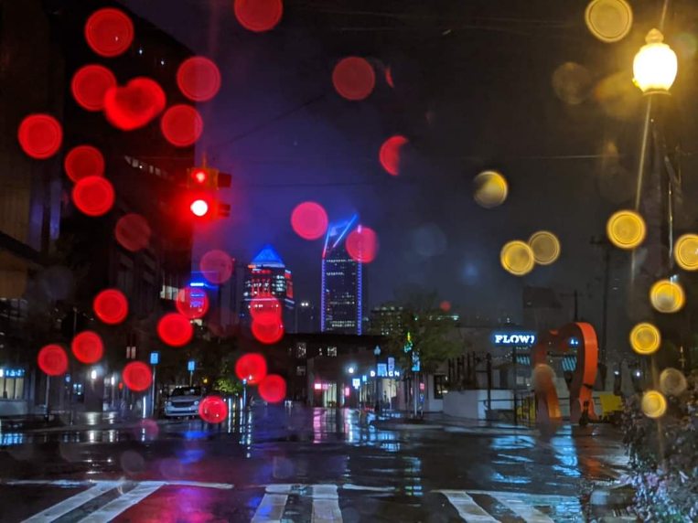 charlotte nc city streets at night with lights illuminating raindrops