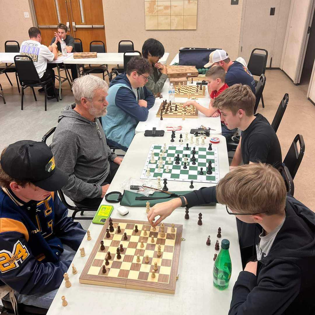 gaston chess club players finishing chess matches